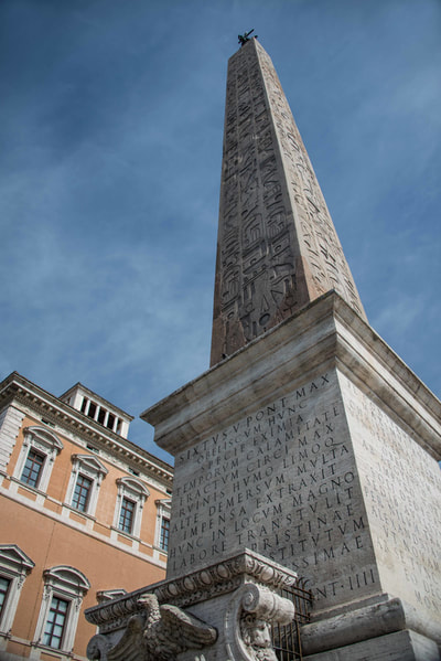 The Lateran Obelisk is the largest standing ancient Egyptian obelisk in the world, and it is also the tallest obelisk in Italy. It originally weighed 413 metric tons (455 tons), but after collapsing and being re-erected 4 meters (13 feet) shorter, now weighs around 300 metric tons (330 tons).[1][2] It is located in the square across from the Archbasilica of St. John Lateran and the San Giovanni Addolorata Hospital. Originally from the temple of Amun in Karnak,map the obelisk was first brought to Alexandria over the Nile by obelisk ship in the early 4th century along with the Obelisk of Theodosius by Constantius II. He intended to bring them both to Constantinople, his new capital for the Roman empire. The obelisk never made it there. (Wikipedia)