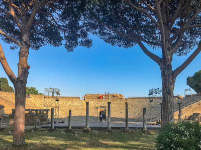The Roman theater at Ostia Antica is staged for a dramatic performance by Ave Maria University students.